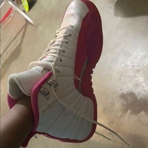 Pink and white Jordan 12s